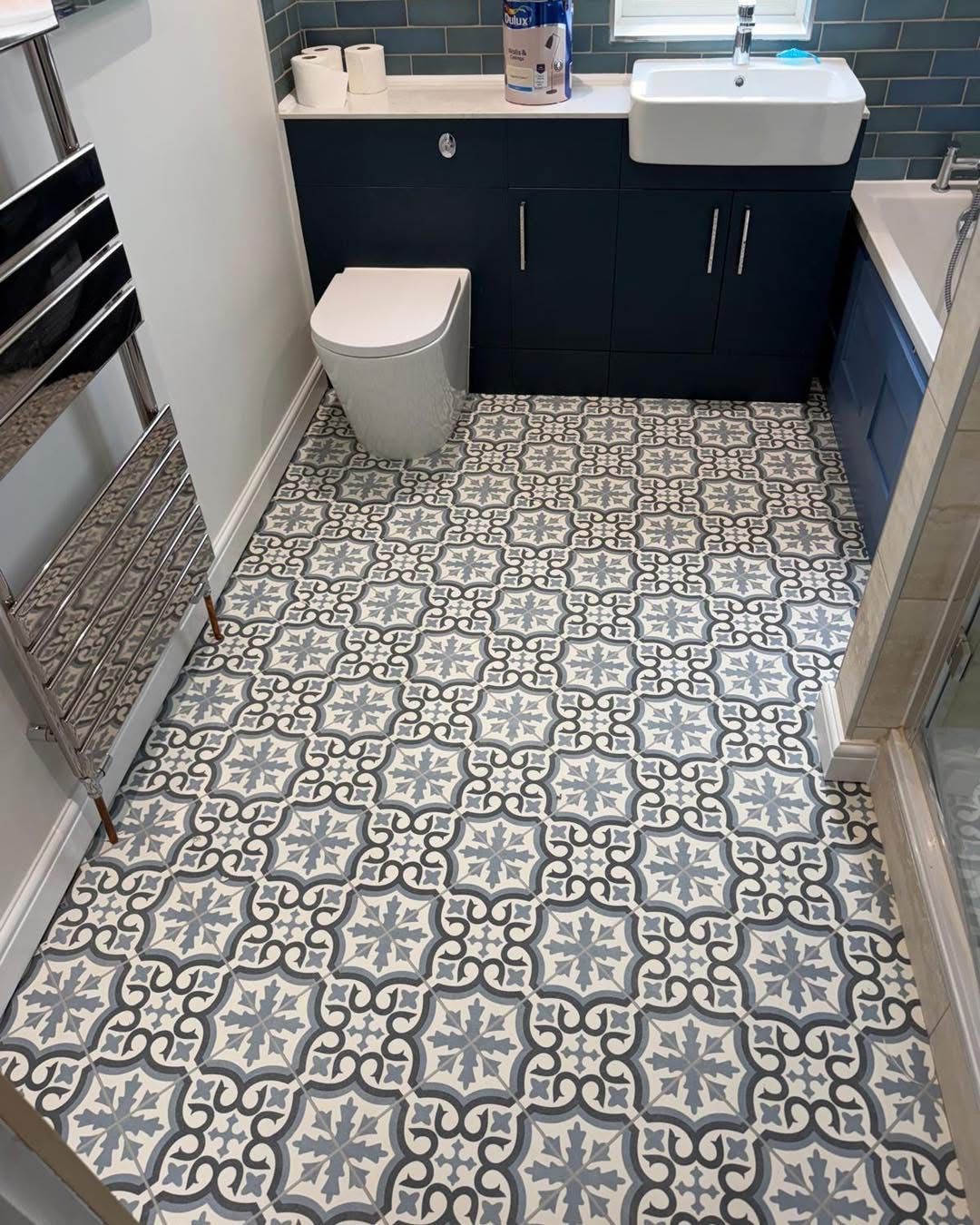 Grey and white patterned vinyl flooring fitted in a bathroom